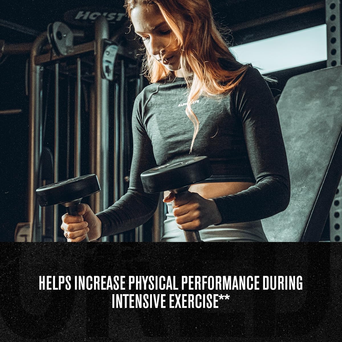 Woman exercising with dumbbells in a gym setting
