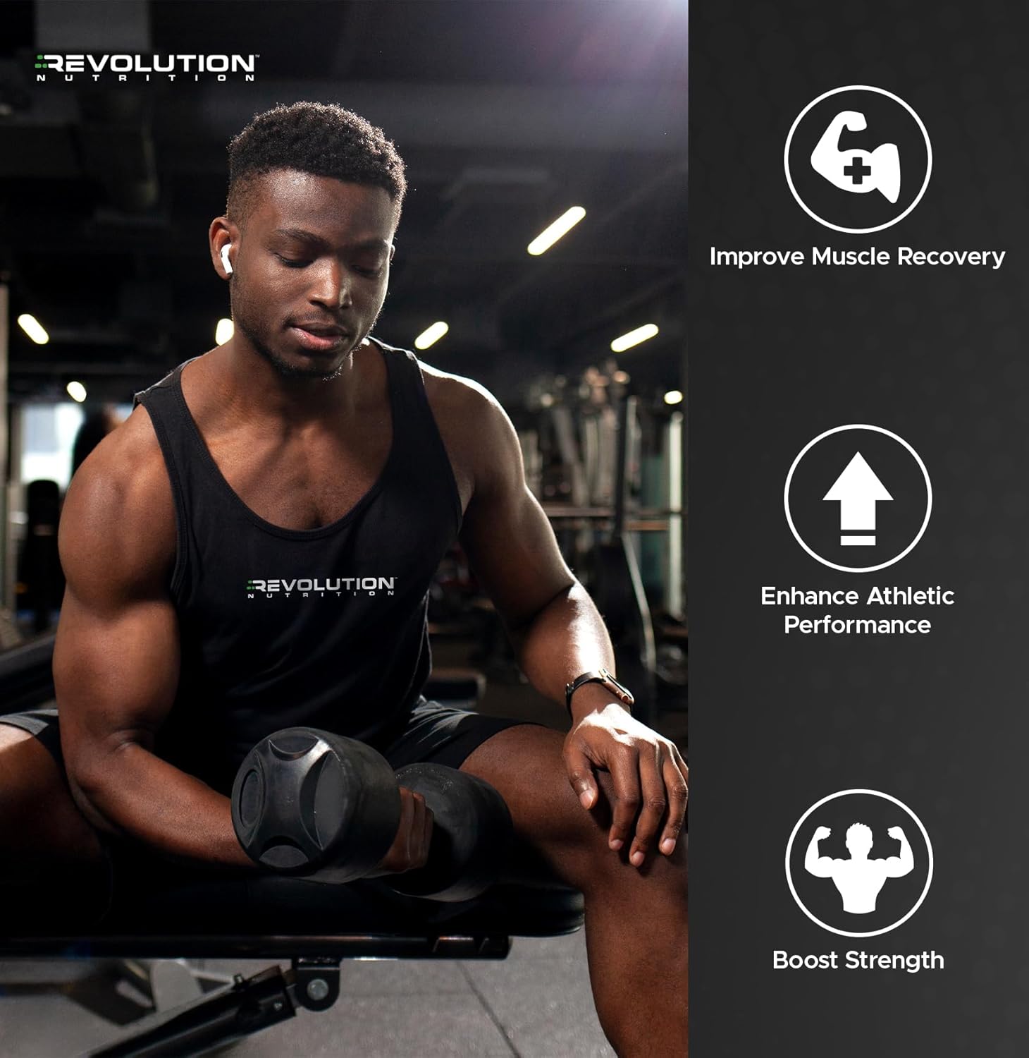 Man in a gym wearing a black tank top with 'Revolution' branding, holding a medicine ball.