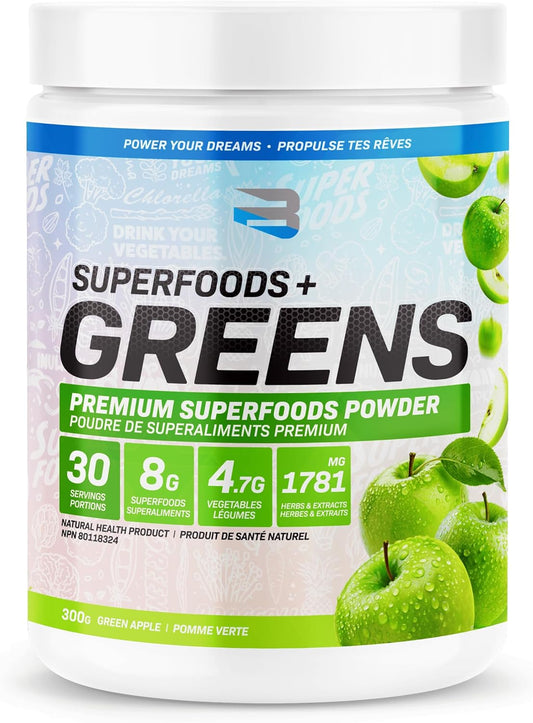 Superfoods + Greens powder container with green apples on a white background